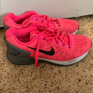 Hot pink nike shoes.